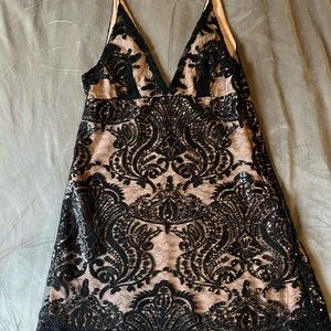Free people dress. Size 6. Zipper closure. Nude slip with black lace/sequin over